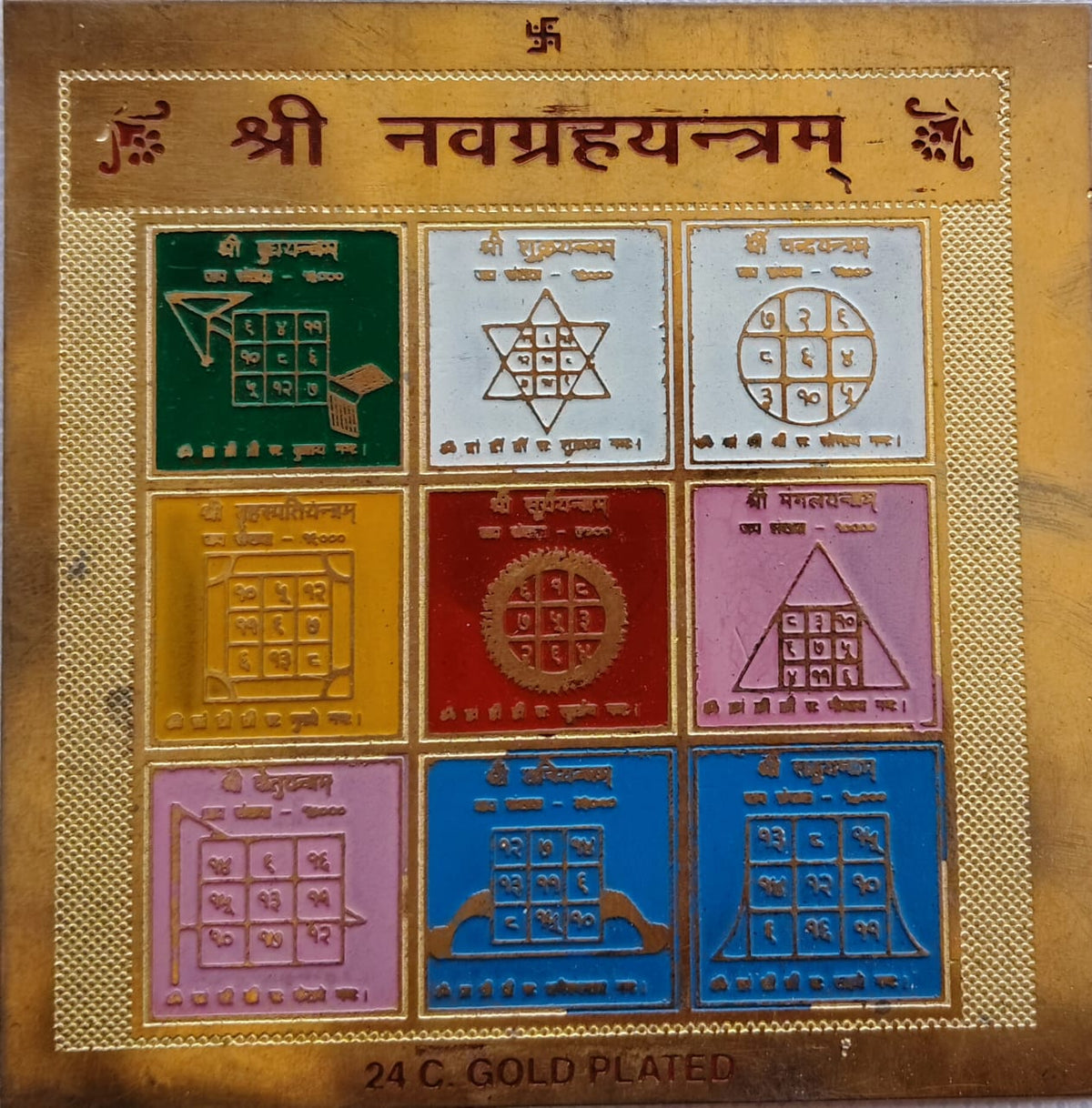 • 24K Gold Plated Shree Navgrah Yantram featuring a 9-grid multi-colored layout representing all nine astrological planets with sacred geometric symbols.
