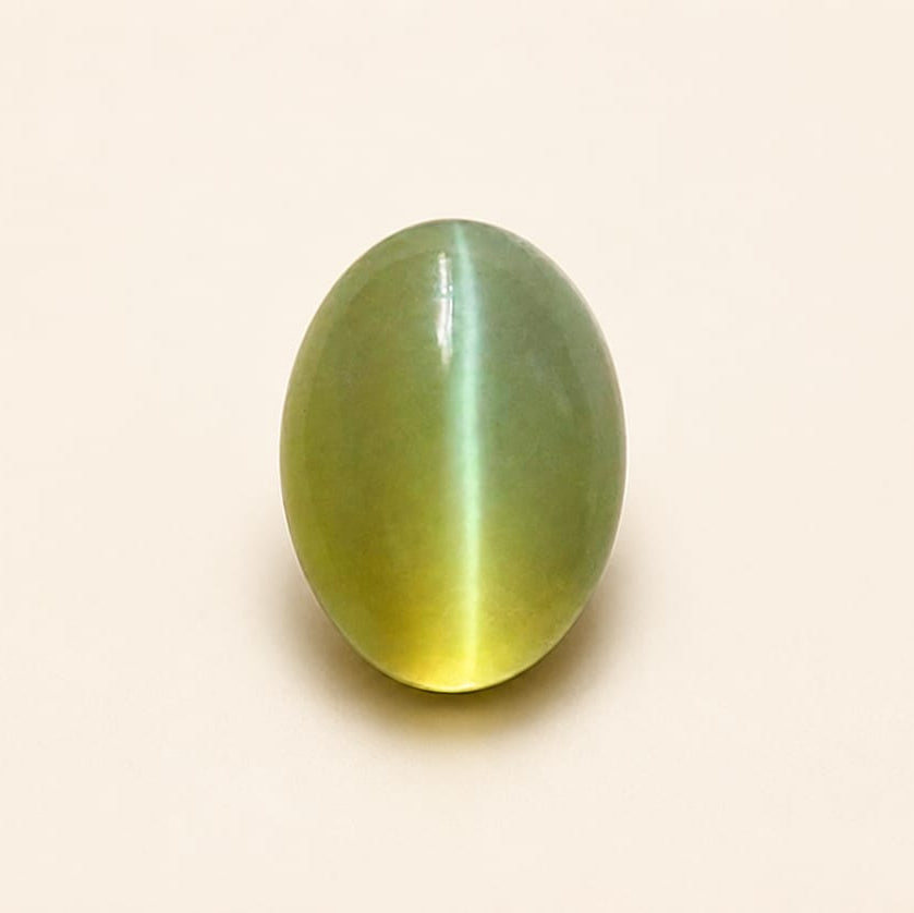 Cat's eye gemstone on a beige background